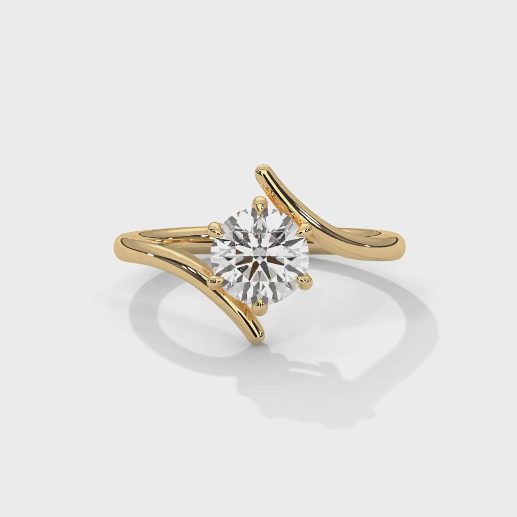 Twist-shoulder solitaire ring in yellow gold, rotating product video
