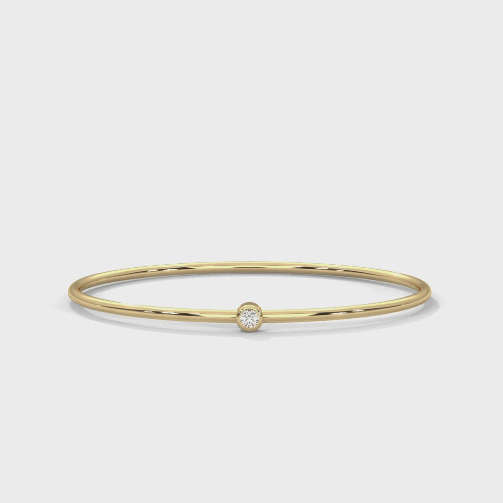 Single-Stone Slim Bangle rotating product video in yellow gold
