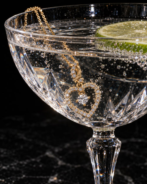 SENVIRRA floating heart necklace photographed in a crystal coupe